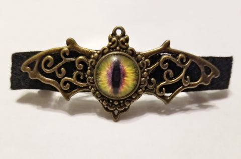 Bronze winged eye ball hair clip