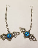 Long chain silver winged blue eye earrings