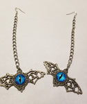 Long chain silver winged blue eye earrings