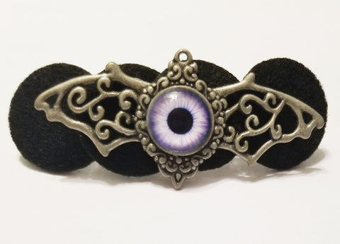 Silver winged purple eye hair clip